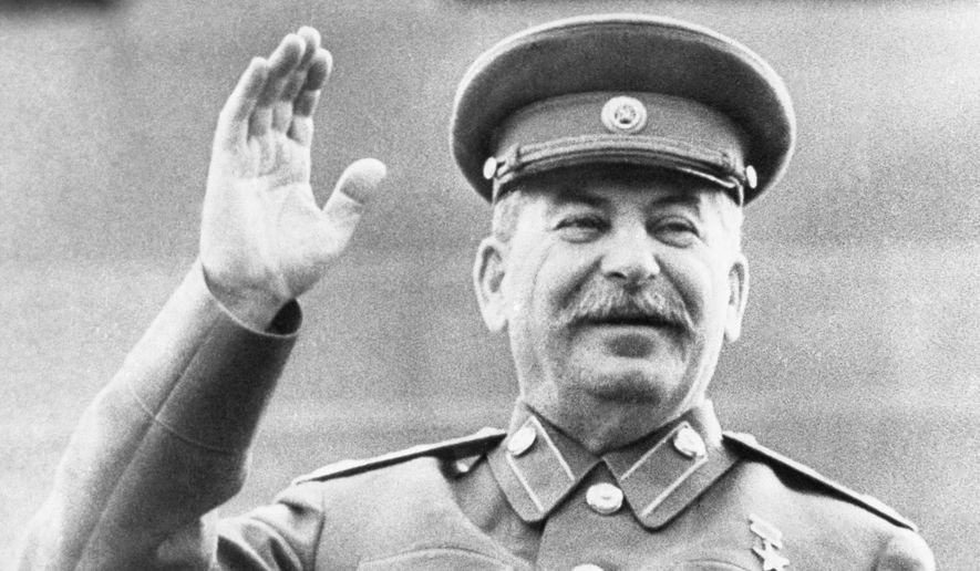 Soviet leader Josef Stalin raises his right hand in salute while reviewing a May Day Parade in Red Square in Moscow, on May 1, 1946. Abortions were banned under Stalin but became commonplace under later Kremlin leaders. Under President Vladimir Putin, who has forged a has forged a powerful alliance with the Russian Orthodox Church, now promotes "traditional values" and seeks to boost population growth, officials are considering restricting access to abortion once again. (AP Photo, File)