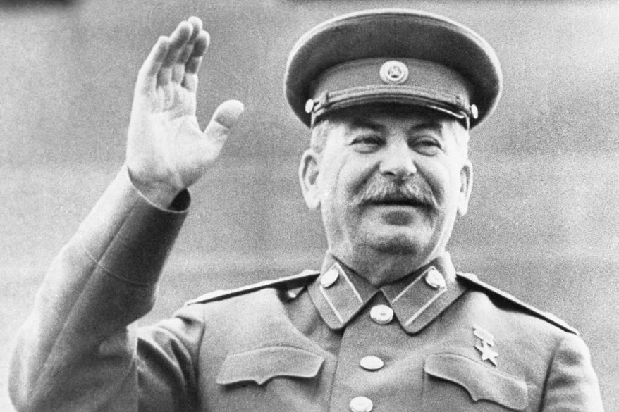 Soviet leader Josef Stalin raises his right hand in salute while reviewing a May Day Parade in Red Square in Moscow, on May 1, 1946. Abortions were banned under Stalin but became commonplace under later Kremlin leaders. Under President Vladimir Putin, who has forged a has forged a powerful alliance with the Russian Orthodox Church, now promotes "traditional values" and seeks to boost population growth, officials are considering restricting access to abortion once again. (AP Photo, File)