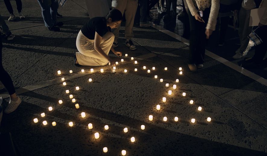 Rutgers University's students place candles with the Star of David pattern to hold solidarity and vigil for Israel on Wednesday, Oct. 25, 2023, in New Brunswick, N.J. (AP Photo/Andres Kudacki) ** FILE **
