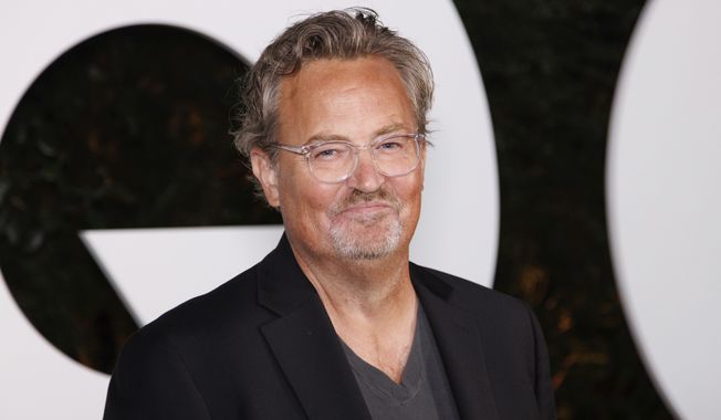 FILE - Matthew Perry arrives at the GQ Men of the Year Party on Thursday, Nov.17, 2022, in West Hollywood, Calif. Perry, who starred as Chandler Bing in the hit series 鈥淔riends,鈥� has died. He was 54. The Emmy-nominated actor was found dead of an apparent drowning at his Los Angeles home on Saturday, according to the Los Angeles Times and celebrity website TMZ, which was the first to report the news. Both outlets cited unnamed sources confirming Perry鈥檚 death. His publicists and other representatives did not immediately return messages seeking comment. (Photo by Willy Sanjuan/Invision/AP, File)