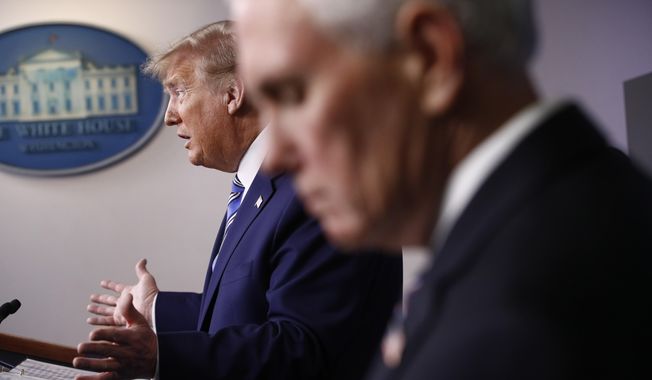 Then-Vice President Mike Pence, right, listens as then-President Donald Trump speaks during a coronavirus task force briefing at the White House, Sunday, April 19, 2020, in Washington. (AP Photo/Patrick Semansky, File)