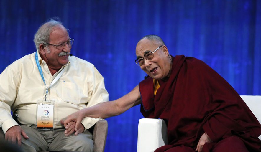 The Dalai Lama (right) laughs with Harvard&#x27;s Kennedy School Prof. Marshall Ganz after playfully pulling his mustache at Massachusetts Institute of Technology in Cambridge, Mass., Friday, Oct. 31, 2014. (AP Photo/Elise Amendola)