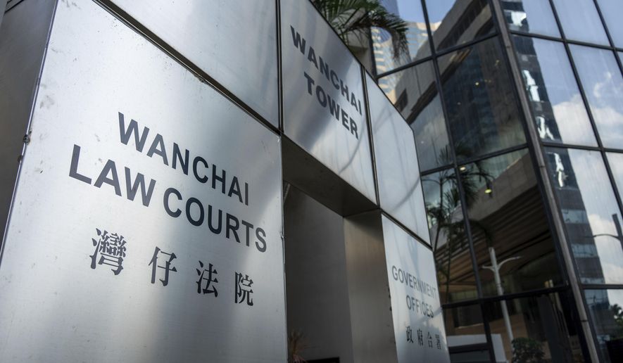 The sign for the Wan Chai Distict Court where the sentences for four former University of Hong Kong student leaders were handed down in Hong Kong, Monday, Oct. 30, 2023. Four former student leaders from the University of Hong Kong have been sentenced to two years in prison for inciting people to wound others through their praise of a man who stabbed a police officer before killing himself in 2021. (AP Photo/Vernon Yuen)