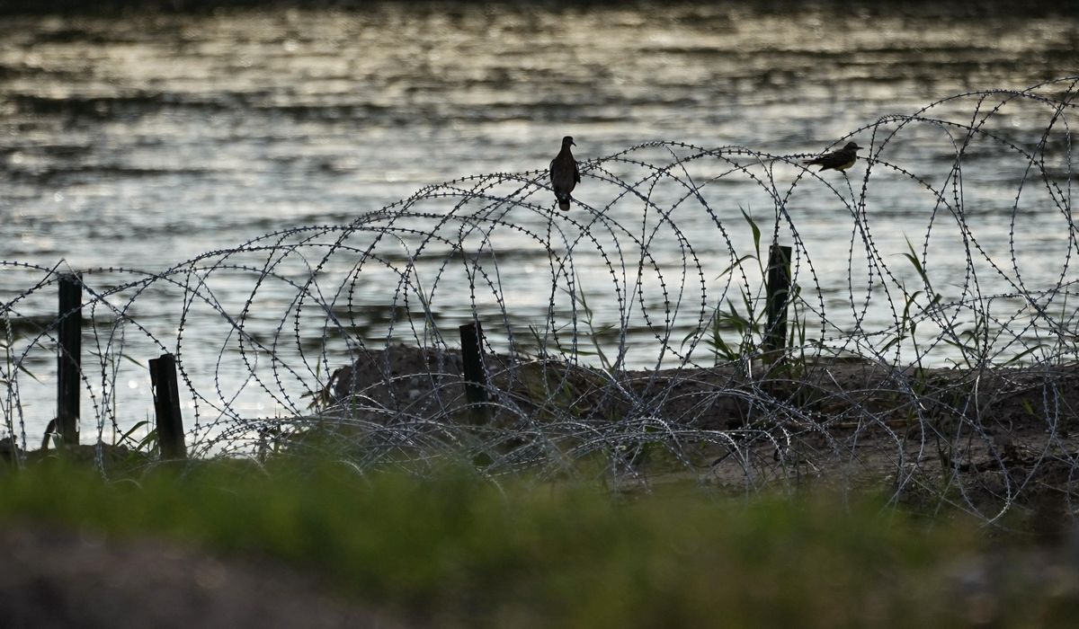 NextImg:Judge orders federal agents to stop cutting Texas razor wire for now at busy Mexico border crossing