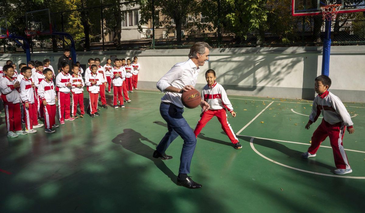 NextImg:California Gov. Gavin Newsom steamrolls child during schoolyard basketball game in China