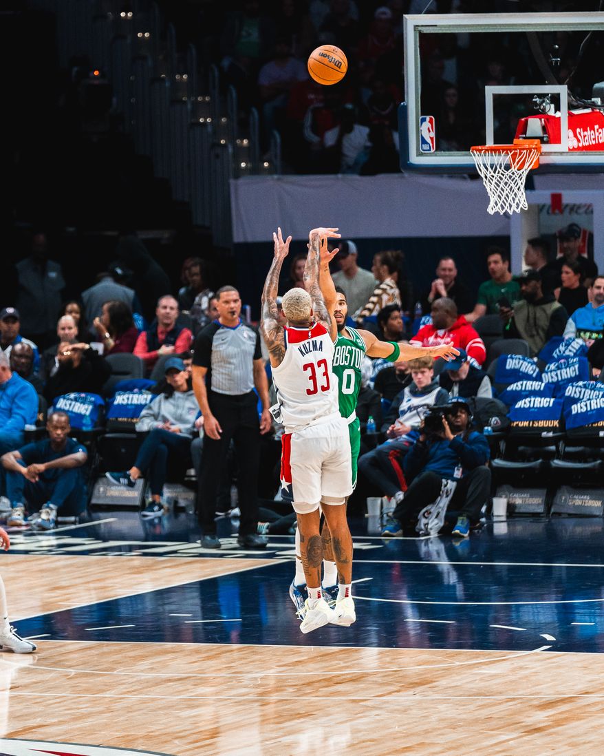 Washington, D.C.: Kyle Kuzma (33) shoots a three-point shot over defender Jayson Tatum (0) The Washington Wizards fall to the Boston Celtics in their second home game of the season from Capital One Arena in Washington, DC on October 30th, 2023. (Photo: Jordan Sabillo | Washington Times Sports)