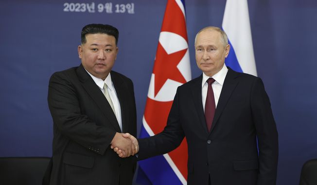 Russian President Vladimir Putin, right, and North Korea&#x27;s leader Kim Jong-un shake hands during their meeting at the Vostochny cosmodrome outside the city of Tsiolkovsky, about 200 kilometers (125 miles) from the city of Blagoveshchensk in the far eastern Amur region, Russia, on Sept. 13, 2023. South Korea&#x27;s top spy agency believes North Korea sent more than a million artillery shells to Russia since August to help fuel Russian President Vladimir Putin鈥檚 war on Ukraine, according to a lawmaker who attended a closed-door briefing Wednesday, Nov. 1, 2023, with intelligence officials. (Vladimir Smirnov, Sputnik, Kremlin Pool Photo via AP, File)
