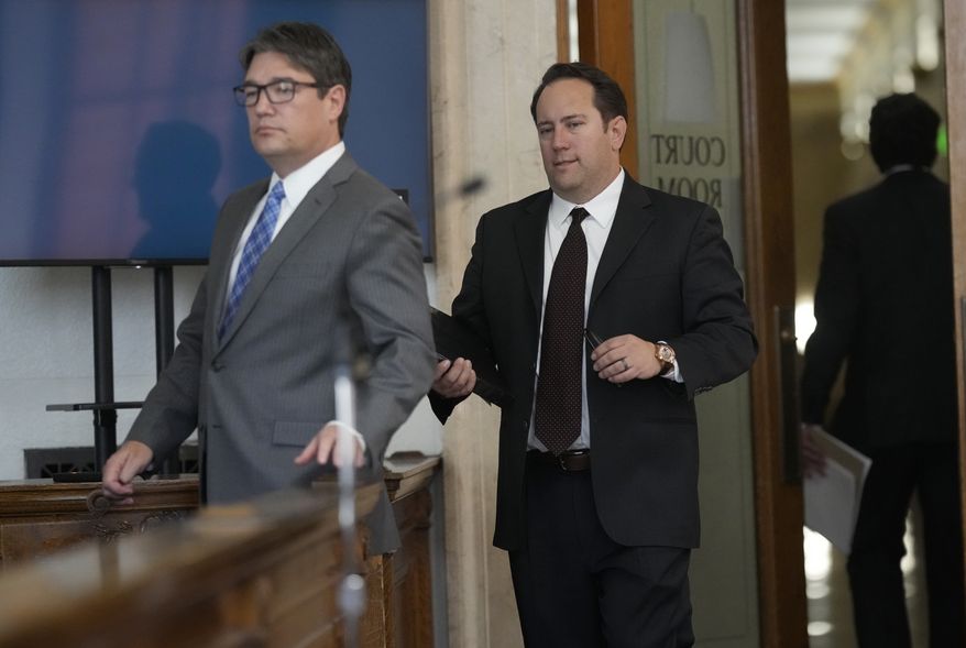 Attorneys Sean Grimsley, left, and Mario Nicolais return to argue during a hearing for a lawsuit to keep former President Donald Trump off the state ballot in Denver District Court Thursday, Nov. 2, 2023, in Denver. (AP Photo/David Zalubowski, Pool)