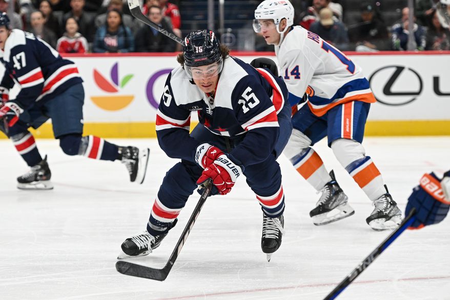 Washington Capitals left wing Sonny Milano (15) reaching for the puck during the third period of an NHL game against the New York Islanders at Capital One Arena in Washington D.C., November 2, 2023. (Photo by Billy Sabatini)
