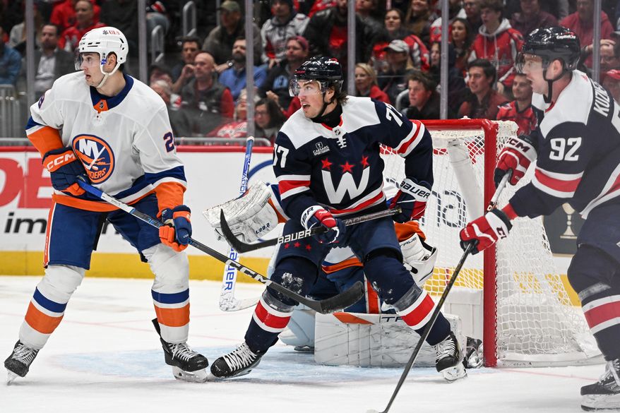 Washington Capitals right wing T.J. Oshie (77) fighting for position in front of the net during the third period of an NHL game against the New York Islanders at Capital One Arena in Washington D.C., November 2, 2023. (Photo by Billy Sabatini)