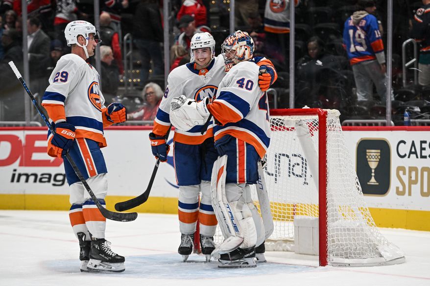 New York Islanders goalie Semyon Varlamov (40) getting congratulated by teammates after the team’s 3-0 victory over the Washington Capitals at Capital One Arena in Washington D.C., November 2, 2023. (Photo by Billy Sabatini)