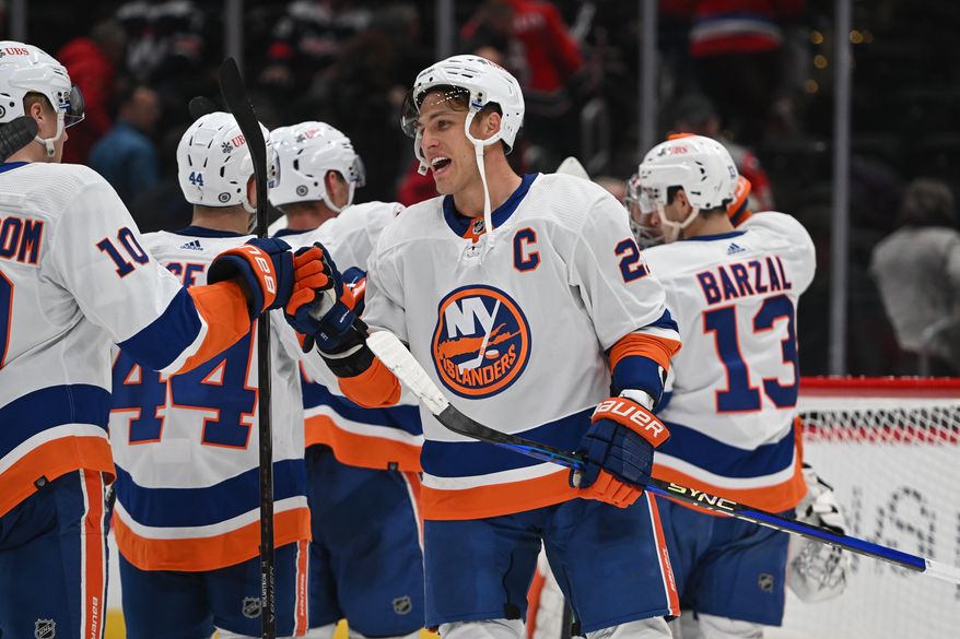 New York Islanders forward Anders Lee (27) congratulating teammates after the team’s 3-0 victory over the Washington Capitals at Capital One Arena in Washington D.C., November 2, 2023. (Photo by Billy Sabatini)