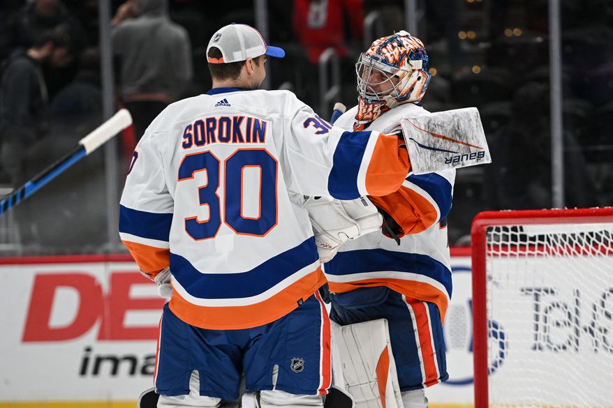 New York Islanders goalie Semyon Varlamov (40) getting congratulated by teammate Ilya Sorokin (30) after the team’s 3-0 victory over the Washington Capitals at Capital One Arena in Washington D.C., November 2, 2023. (Photo by Billy Sabatini)