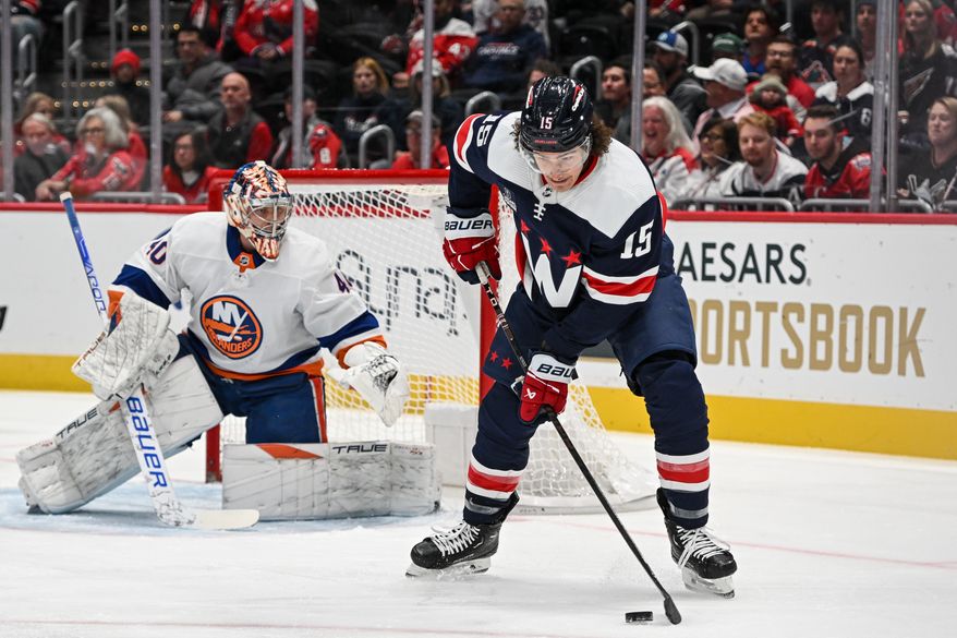 Washington Capitals left wing Sonny Milano (15) trying to gain control of the puck in front of the net during the first period of an NHL game against the New York Islanders at Capital One Arena in Washington D.C., November 2, 2023. (Photo by Billy Sabatini)