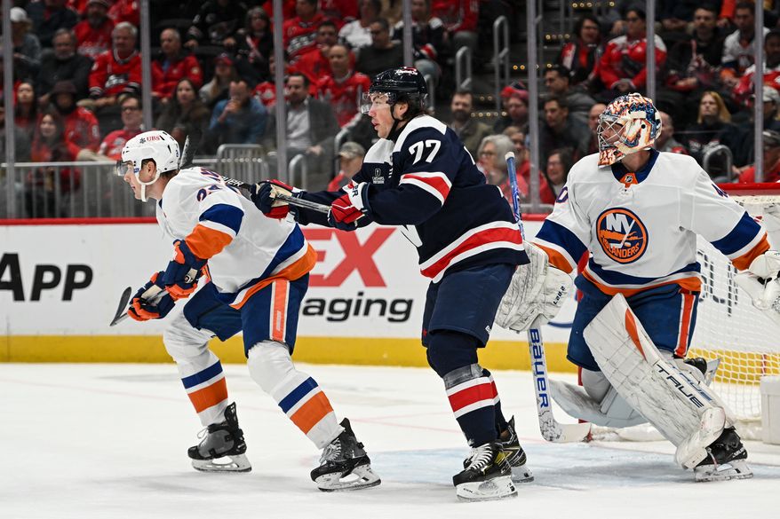 Washington Capitals right wing T.J. Oshie (77) fighting for position in front of the net during the first period of an NHL game against the New York Islanders at Capital One Arena in Washington D.C., November 2, 2023. (Photo by Billy Sabatini)