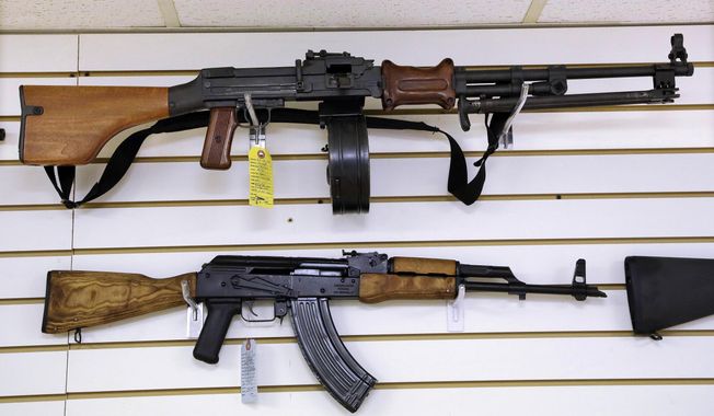 Assault style weapons are displayed for sale at Capitol City Arms Supply on Jan. 16, 2013, in Springfield, Ill. A federal appeals court on Friday, Nov. 3, 2023, upheld Illinois&#x27; prohibition on high-power semiautomatic weapons, refusing to put a hold on the law adopted in response to the mass killing of seven people at a 2022 parade in the Chicago suburb of Highland Park. (AP Photo/Seth Perlman, File)