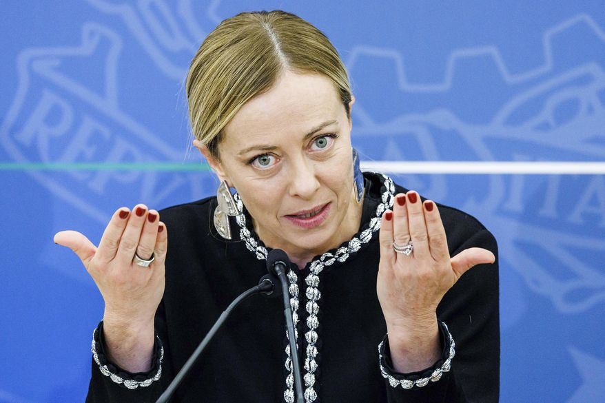 Italy's Premier Giorgia Meloni meets the media following a cabinet meeting in Rome Friday, Nov. 3, 2023. (Roberto Monaldo/LaPresse via AP)