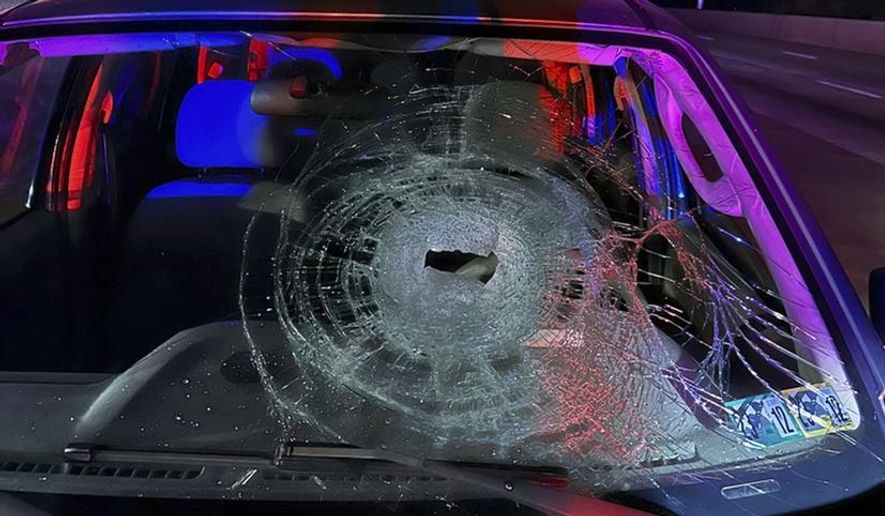 This photo released by Pennsylvania State Police on Friday, Nov. 3, 2023, shows a vehicle damaged by a rock thrown from a highway overpass near New Cumberland, Pa. Authorities asked the public's help identifying the suspects believed to have damaged six vehicles in four incidents over the past month, saying they are thought to live near the Pleasant View Road overpass of Interstate 83. (Pennsylvania State Police via AP)