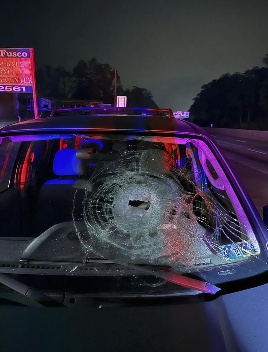 This photo released by Pennsylvania State Police on Friday, Nov. 3, 2023, shows a vehicle damaged by a rock thrown from a highway overpass near New Cumberland, Pa. Authorities asked the public's help identifying the suspects believed to have damaged six vehicles in four incidents over the past month, saying they are thought to live near the Pleasant View Road overpass of Interstate 83. (Pennsylvania State Police via AP)