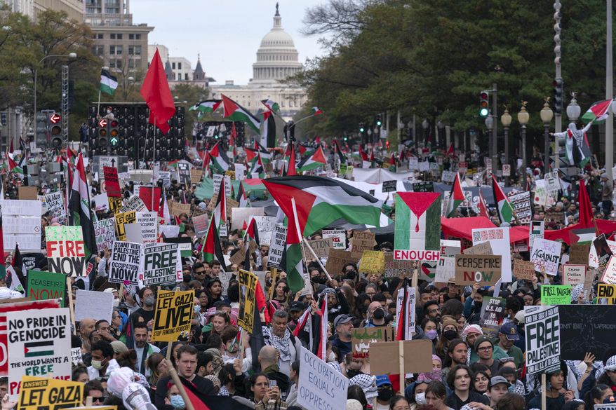 With the U.S Capitol n the background thousands of protesters rally during a pro-Palestinian demonstration at Freedom Plaza in Washington, Saturday, Nov. 4, 2023.(AP Photo/Jose Luis Magana)