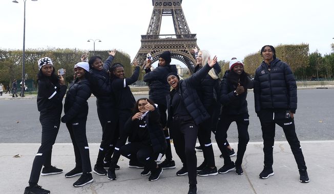 South Carolina college basketball players pose in front of the Eiffel Tower, Thursday Nov. 2, 2023 in Paris. Notre Dame will face South Carolina in a NCAA college basketball game Monday Nov. 6 in Paris. (AP Photo/Aurelien Morissard)