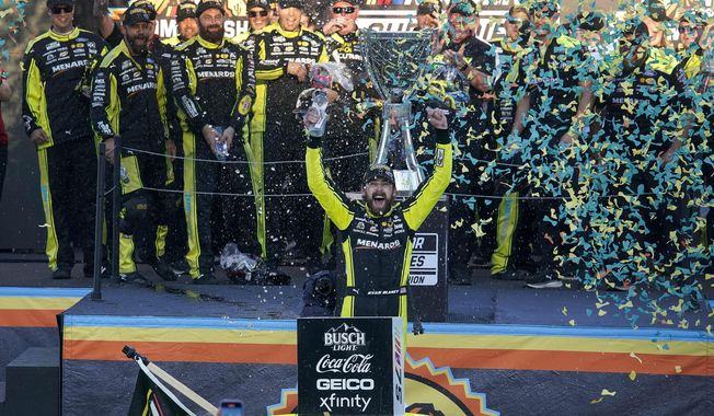 Ryan Blaney, foreground, celebrates after winning the NASCAR Cup Series Championship Cup at Phoenix Raceway, Sunday, Nov. 5, 2023, in Avondale, Ariz. (AP Photo/Darryl Webb) **FILE**
