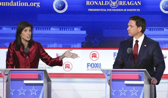 Republican presidential candidate and former U.N. Ambassador Nikki Haley, left, with Florida Gov. Ron DeSantis, speaks during a Republican presidential primary debate hosted by FOX Business Network and Univision, Sept. 27, 2023, at the Ronald Reagan Presidential Library in Simi Valley, Calif. (AP Photo/Mark J. Terrill, File)