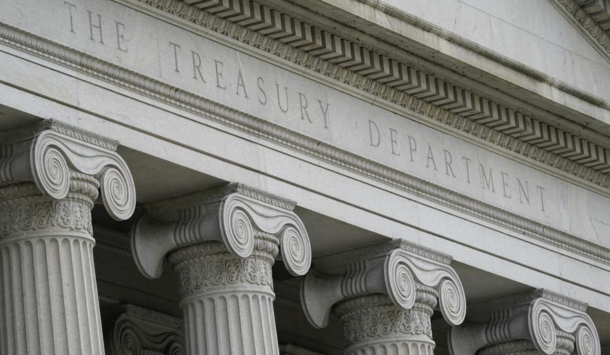 The Treasury Building is viewed in Washington, May 4, 2021. The Treasury Department has imposed sanctions on 13 members of Mexico’s powerful Sinaloa cartel and four Sonora, Mexico-based firms accused of trafficking fentanyl and other drugs into the United States, on Tuesday. Included in the sanctions are Juan Carlos Morgan Huerta, who allegedly manages cartel operations in Nogales and oversees the trafficking of multi-ton quantities of drugs, as well as members of his family, and his associates. (AP Photo/Patrick Semansky, File)