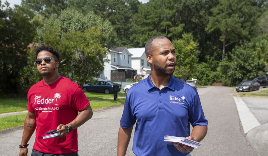 State Rep. Deon Tedder, D-North Charleston, right, canvasses with his team for the District 42 election in North Charleston, SC, on Saturday, Aug. 26, 2023. Tedder won a special election Tuesday for an open Senate seat and will be the youngest senator in the chamber at 33 when he takes the oath of office in January. (Daniel Sarch/The Post And Courier via AP, File)