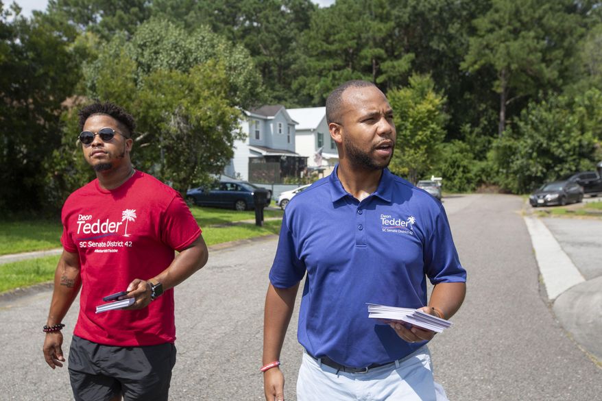 State Rep. Deon Tedder, D-North Charleston, right, canvasses with his team for the District 42 election in North Charleston, SC, on Saturday, Aug. 26, 2023. Tedder won a special election Tuesday for an open Senate seat and will be the youngest senator in the chamber at 33 when he takes the oath of office in January. (Daniel Sarch/The Post And Courier via AP, File)