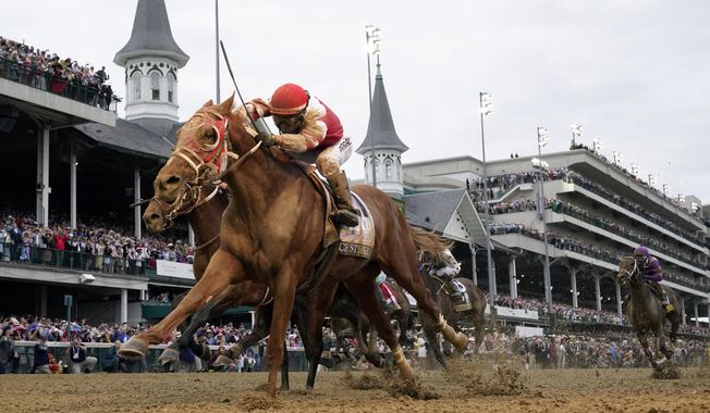 Rich Strike, with Sonny Leon aboard, crosses the finish line to win the 148th running of the Kentucky Derby horse race at Churchill Downs Saturday, May 7, 2022, in Louisville, Ky. Rich Strike, upset winner of the 2022 Kentucky Derby, has been retired after injuries kept him from returning to racing. The 4-year-old colt will be sold as a stallion prospect. (AP Photo/Jeff Roberson, File)