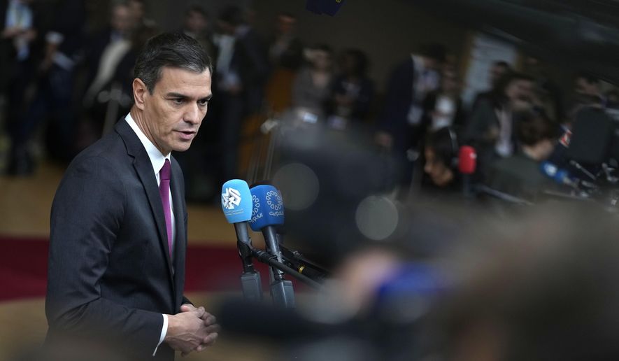 Spain's Prime Minister Pedro Sanchez speaks with the media as he arrives at the European Council building in Brussels, on Oct. 26, 2023. Spain's Socialist Party has struck a deal with a fringe Catalan separatist party to grant an amnesty for potentially thousands of people involved in the region's failed secession bid in exchange for its key backing of acting Spanish Prime Minister Pedro Sánchez to form a new government. Socialist lawmaker and party official Santos Cerdán announced the deal on Thursday, Nov. 9, 2023, in Brussels. (AP Photo/Virginia Mayo)