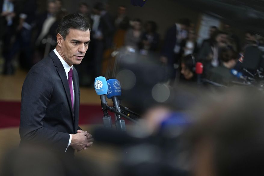 Spain's Prime Minister Pedro Sanchez speaks with the media as he arrives at the European Council building in Brussels, on Oct. 26, 2023. Spain's Socialist Party has struck a deal with a fringe Catalan separatist party to grant an amnesty for potentially thousands of people involved in the region's failed secession bid in exchange for its key backing of acting Spanish Prime Minister Pedro Sánchez to form a new government. Socialist lawmaker and party official Santos Cerdán announced the deal on Thursday, Nov. 9, 2023, in Brussels. (AP Photo/Virginia Mayo)
