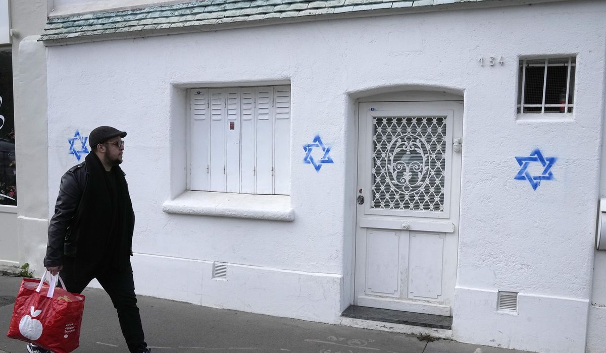NextImg:France blames Russia for a digital effort to whip up online controversy over Stars of David graffiti