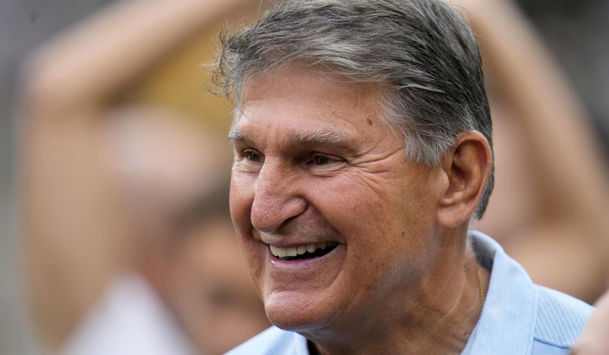 FILE - Sen. Joe Manchin, D-W.Va., visits the sidelines at Acrisure Stadium during warm ups before an NFL football game between the Pittsburgh Steelers and the San Francisco 49ers in Pittsburgh, Sept. 10, 2023. Manchin announced he won't seek reelection in 2024, giving Republicans a prime opportunity to gain a seat in the heavily GOP state. (AP Photo/Gene J. Puskar, File)