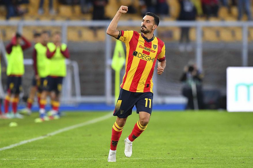 Lecce's Nicola Sansone celebrates after scoring during the Serie A soccer match between Lecce and AC Milan, at the Via del Mare stadium in Lecce, Italy, Saturday, Nov. 11, 2023. (Giovanni Evangelista/LaPresse via AP)