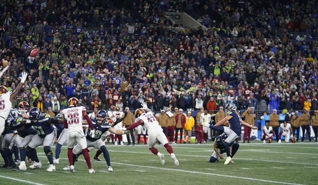 Seattle Seahawks place-kicker Jason Myers (5) kicks a field goal in the second half of an NFL football game against the Washington Commanders in Seattle, Sunday, Nov. 12, 2023. (AP Photo/Lindsey Wasson)