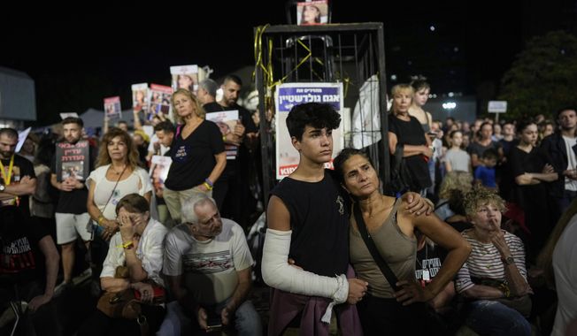 People attend a rally calling for the return of the hostages kidnapped during the Oct. 7 Hamas cross-border attack in Israel, in Tel Aviv, Israel, Saturday, Nov. 11, 2023. (AP Photo/Ohad Zwigenberg)