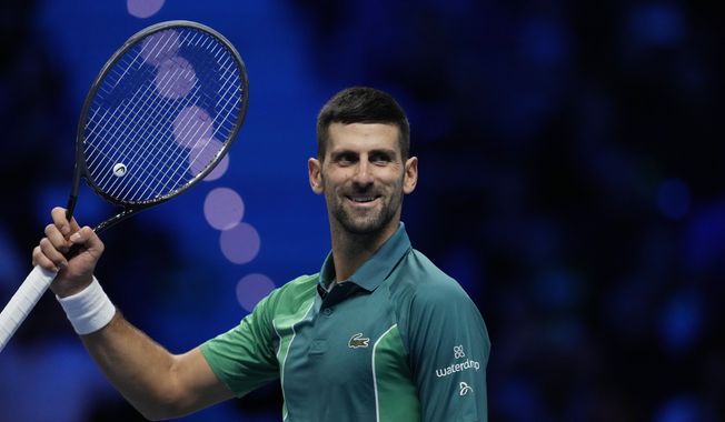 Serbia&#x27;s Novak Djokovic celebrates after winning the singles tennis match against Denmark&#x27;s Holger Rune, of the ATP World Tour Finals at the Pala Alpitour, in Turin, Italy, Monday, Nov. 13, 2023. (AP Photo/Antonio Calanni)