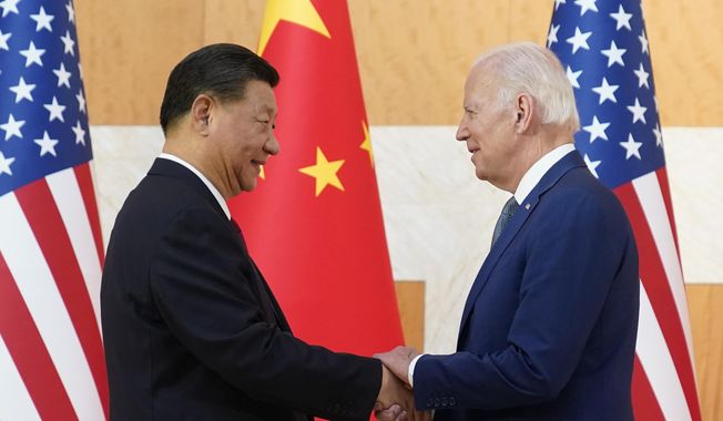 President Joe Biden, right, and Chinese President Xi Jinping shake hands before their meeting on the sidelines of the G20 summit meeting in Nusa Dua, in Bali, Indonesia on Nov. 14, 2022. The U.S. and Chinese leaders meet Wednesday while attending the annual Asia-Pacific Economic Cooperation summit in San Francisco. (AP Photo/Alex Brandon, File)