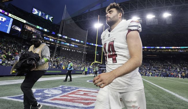 Washington Commanders quarterback Sam Howell walks off the field after the 29-26 loss to the Seattle Seahawks in an NFL football game, Sunday, Nov. 12, 2023, in Seattle. (AP Photo/ John Froschauer)