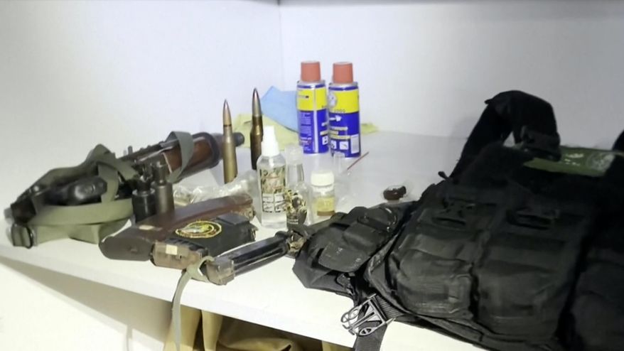 This image taken from a video released by the Israeli Defense Forces, Wednesday, Nov. 15, 2023, shows a bullet proof vest with a Hamas insignia that was found along with weapons the IDF says were found in a medical closet at the MRI center at al-Shifa hospital in Gaza City. (Israel Defense Forces via AP)