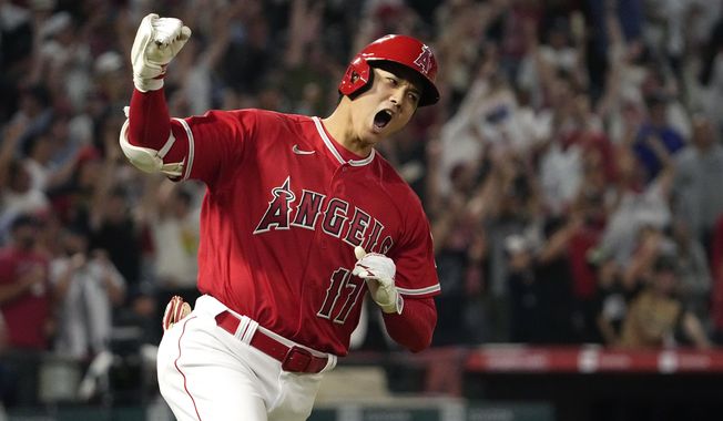 Los Angeles Angels&#x27; Shohei Ohtani celebrates as he rounds first after hitting a two-run home run during the seventh inning of a baseball game against the New York Yankees Monday, July 17, 2023, in Anaheim, Calif. Shohei Ohtani is a favorite to win his second AL Most Valuable Player award, Thursday, Nov. 16, 2023. (AP Photo/Mark J. Terrill, File)