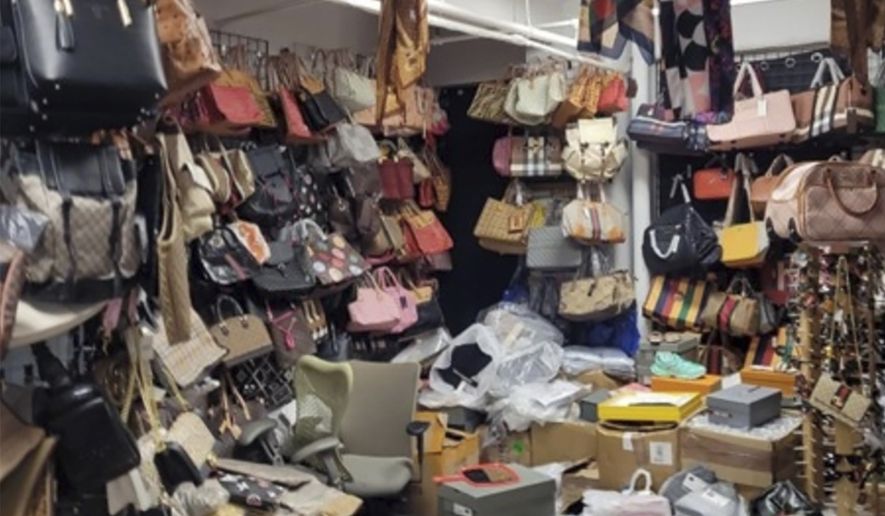FILE: This photo provided by the U.S. Attorney for the Southern District of New York shows counterfeit goods from a storage unit in New York. – U.S. Attorney for the Southern District of New York via AP