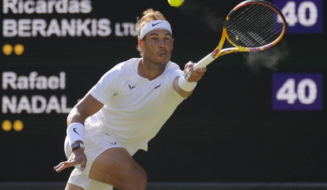 Spain&#x27;s Rafael Nadal returns to Lithuania&#x27;s Ricardas Berankis in a second round men&#x27;s singles match for the Wimbledon tennis championships in London, June 30, 2022. Nadal is sure he&#x27;ll be returning to competition after missing nearly all of 2023 with a hip injury that required surgery. And now he says he&#x27;ll be revealing his comeback plans soon. Nadal wrote Thursday, Nov. 16, 2023 on social media: 鈥淚 confirmed yesterday I&#x27;ll be back鈥� and punctuated that message with a smiling emoji. (AP Photo/Kirsty Wigglesworth, file)