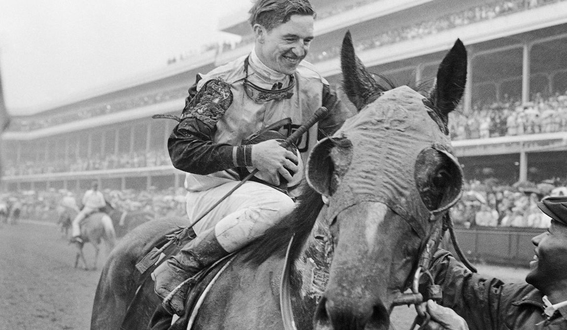Jockey Bob Ussery sits atop Proud Clarion as they entered the winners circle after winning the Kentucky Derby horse race, May 6, 1967 in Louisville. Ussery, a Hall of Fame jockey who won the 1967 Kentucky Derby and then crossed the finish line first in the 1968 edition only to be disqualified days later, died Thursday, Nov. 16, 2023, of congestive heart failure at an assisted living facility in Hollywood, Fla., his son Robert told The Associated Press on Friday. He was 88. (AP Photo/File)