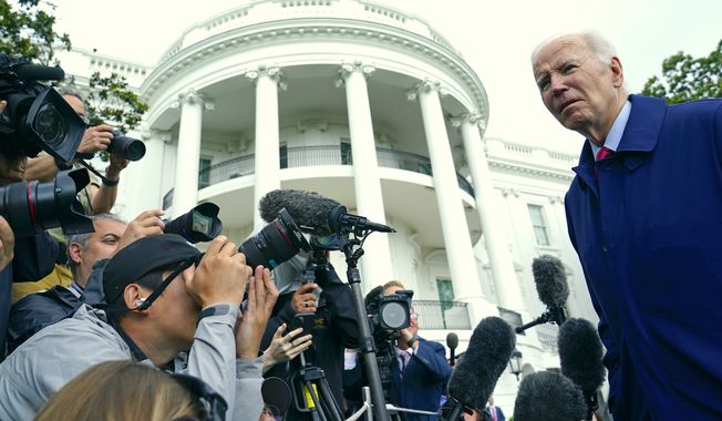 President Joe Biden talks with reporters before boarding Marine One on the South Lawn of the White House in Washington, Monday, May 29, 2023. (AP Photo/Susan Walsh)