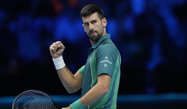Serbia&#x27;s Novak Djokovic reacts after winning a point to Italy&#x27;s Jannik Sinner during their singles final tennis match of the ATP World Tour Finals at the Pala Alpitour, in Turin, Italy, Sunday, Nov. 19, 2023. (AP Photo/Antonio Calanni)
