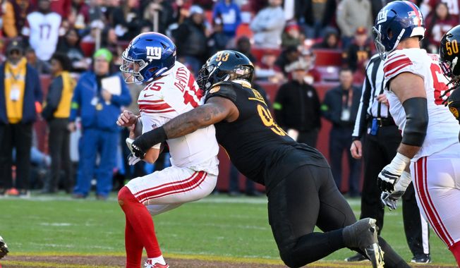 Washington Commanders defensive end Jonathan Allen (93) sacking New York Giants quarterback Tommy DeVito (15) during the second half of an NFL game at FedEx Field in Landover, MD, November 19, 2023. (All-Pro Reels Photo by Billy Sabatini) **FILE**