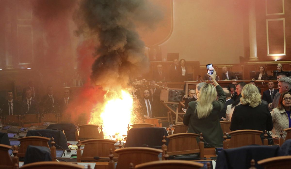NextImg:The Albanian opposition disrupts a Parliament vote on the budget with flares and piled-up chairs